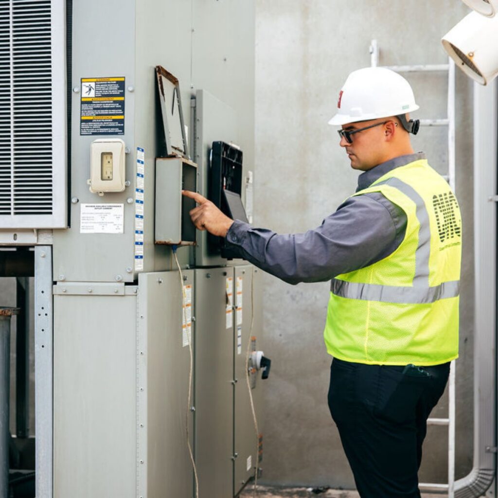 technician working on controls and automations
